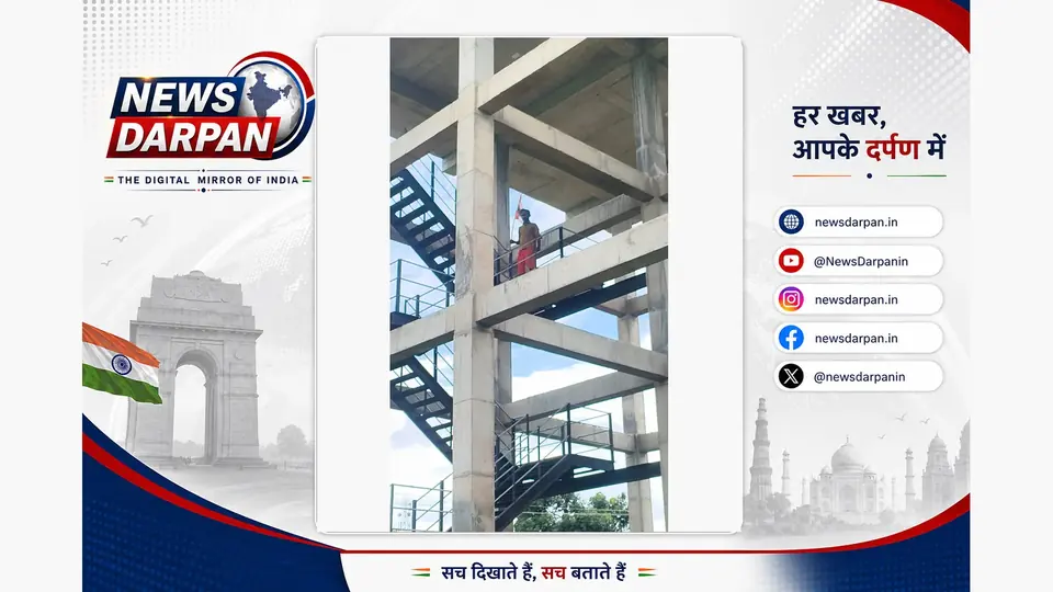 Youth climbs water tank with flag demanding road construction in Shravasti