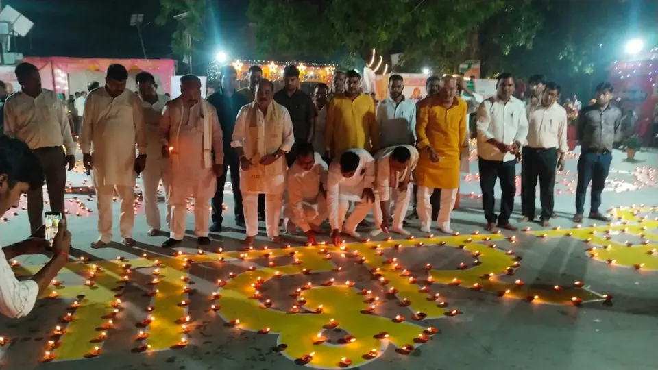 Minister lights ceremonial lamp at temple on PM's birthday celebration