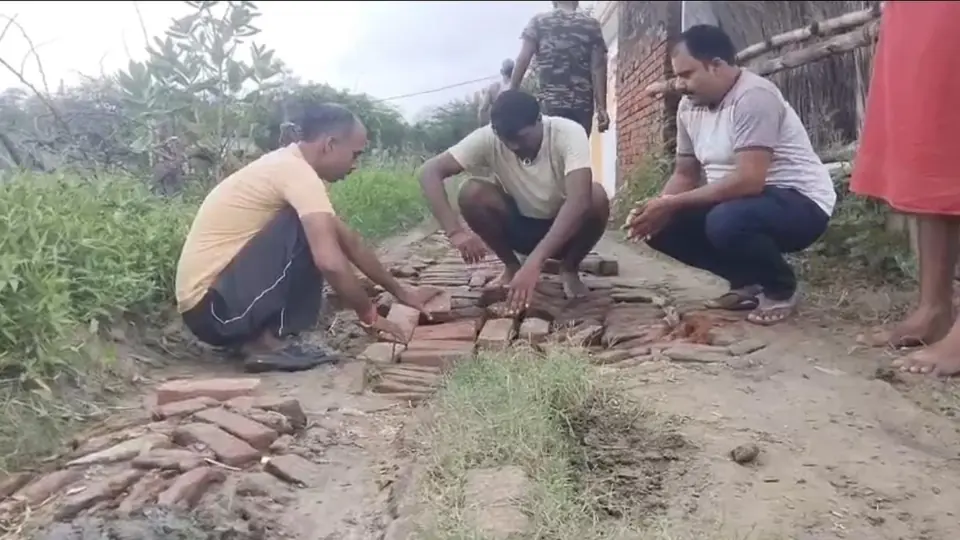 Villagers repair crumbling road after government ignores repeated complaints