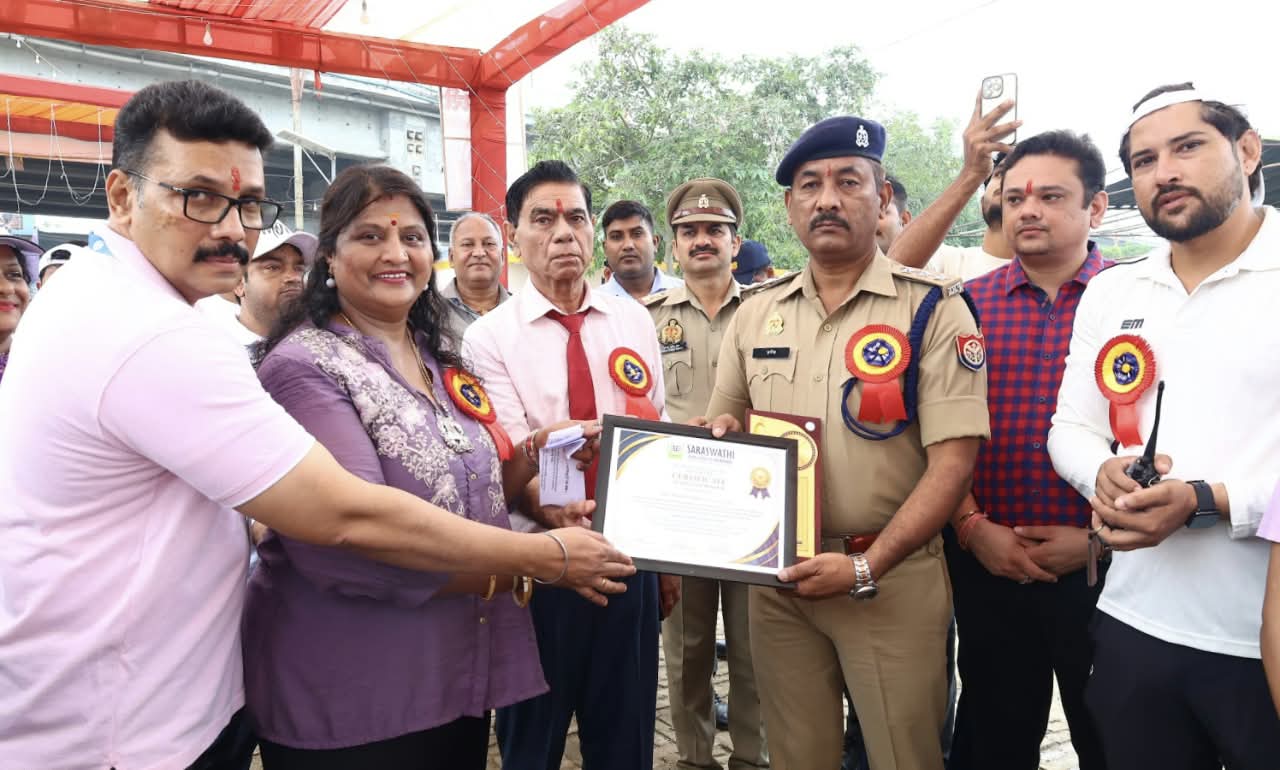 Saraswati College of Nursing honours a police officer with a certificate during the mental health awareness rally in Hapur