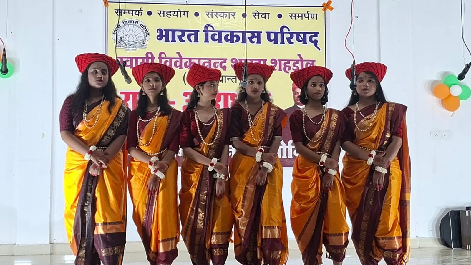 Participants in coordinated traditional dress at a Bharat Vikas Parishad cultural programme in Shahdol