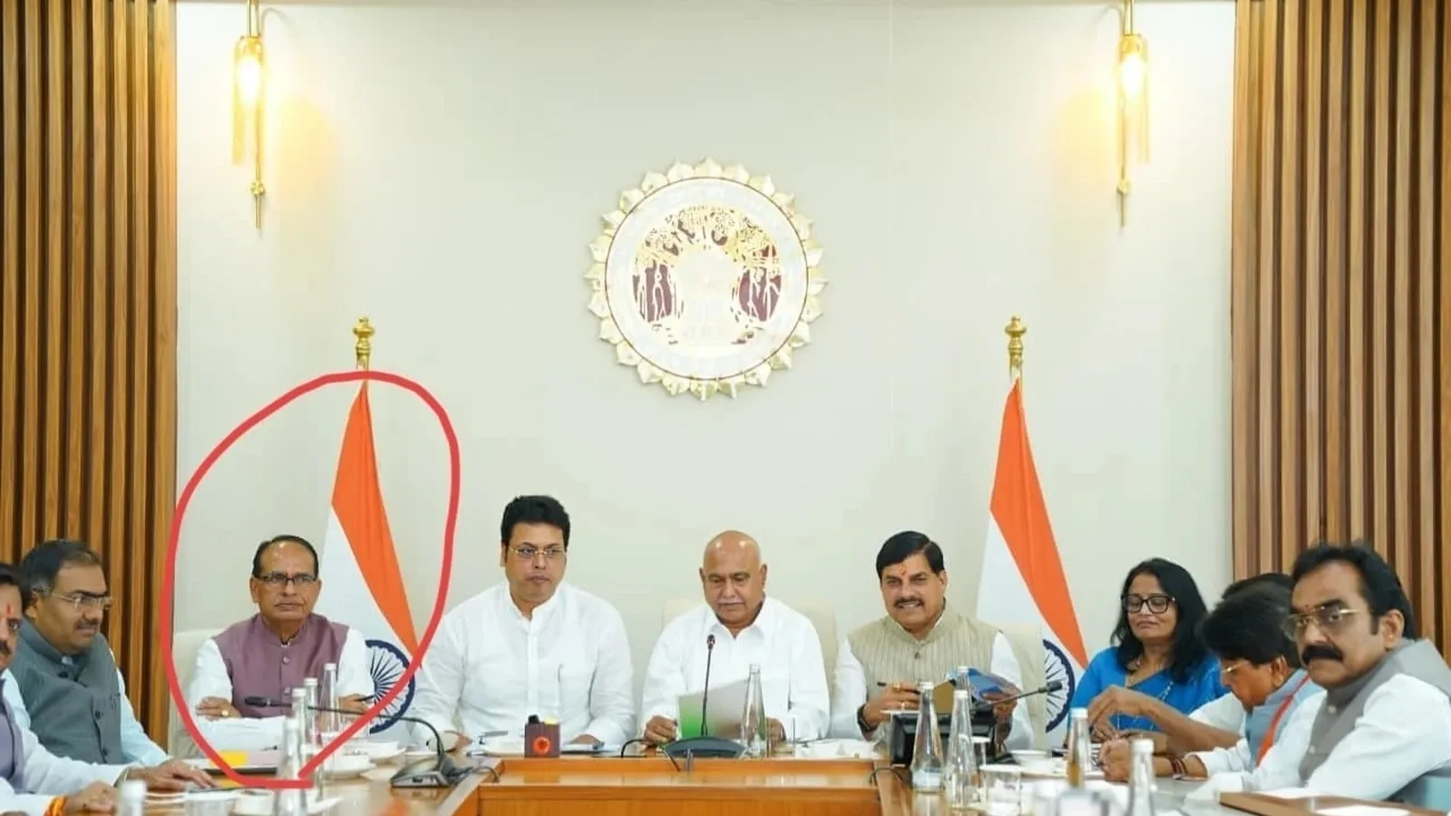 Participants seated around a conference table during the Bhopal BJP core group meeting; red oval annotation retained in supplied image