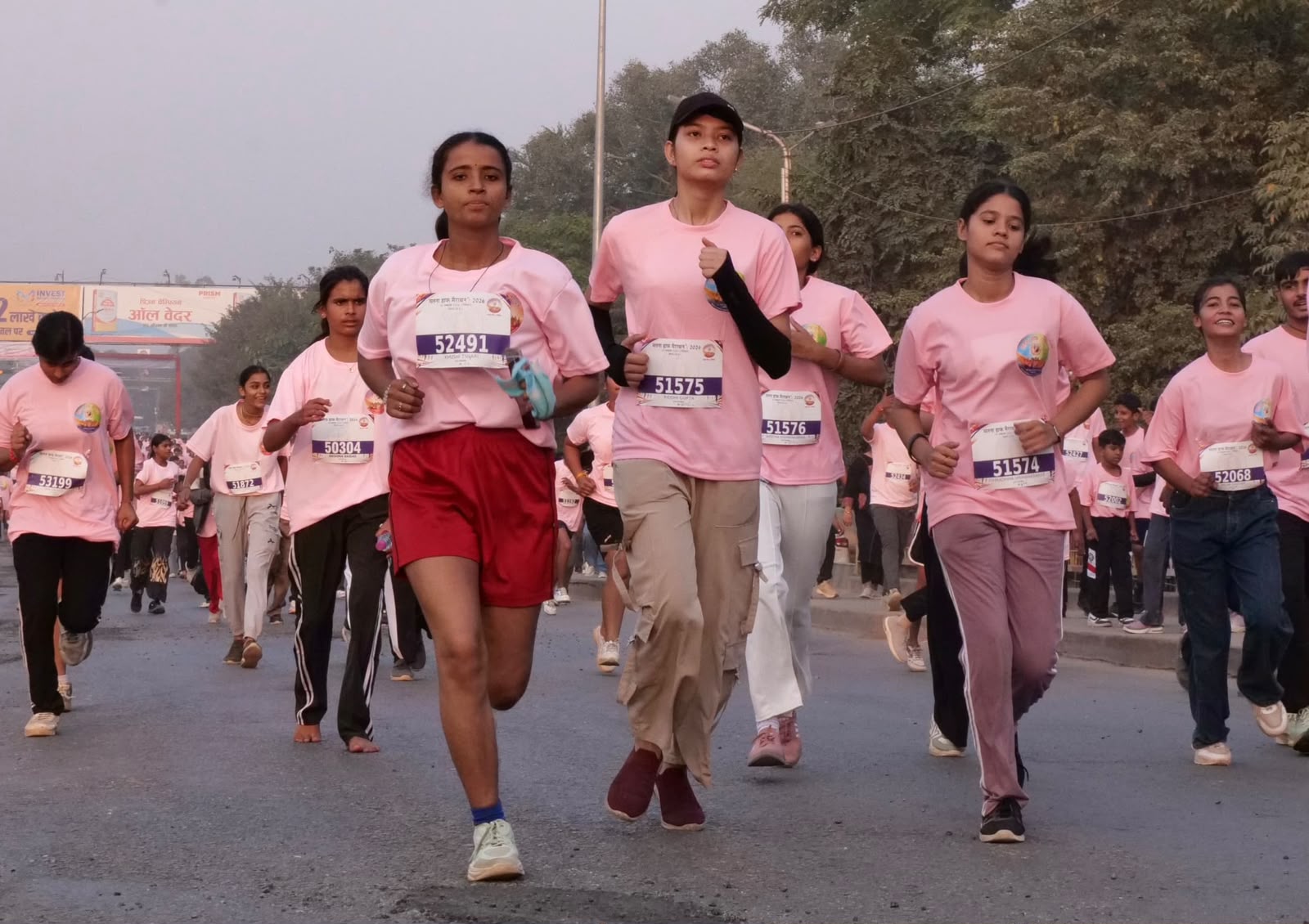 Runners wearing Satna Half Marathon 2026 bibs on the road