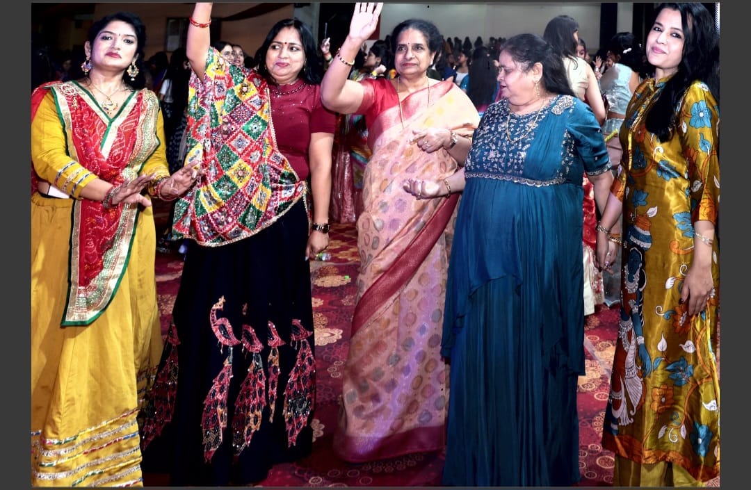 Participants in colourful traditional clothing dance during the celebration