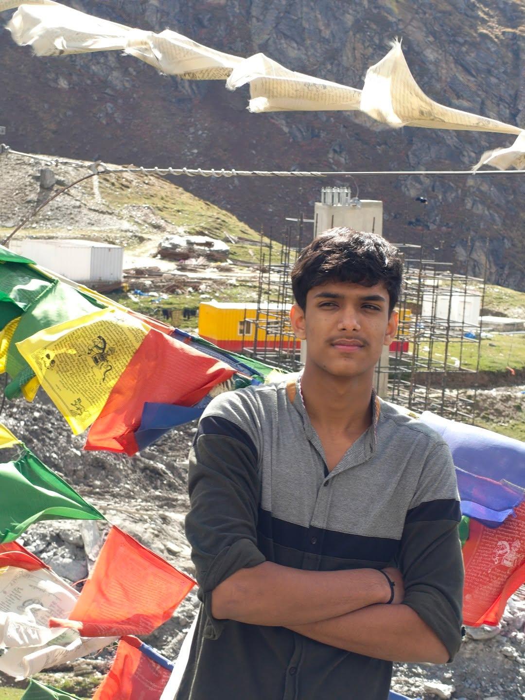 Reporter-supplied portrait of Rudra against a mountain backdrop