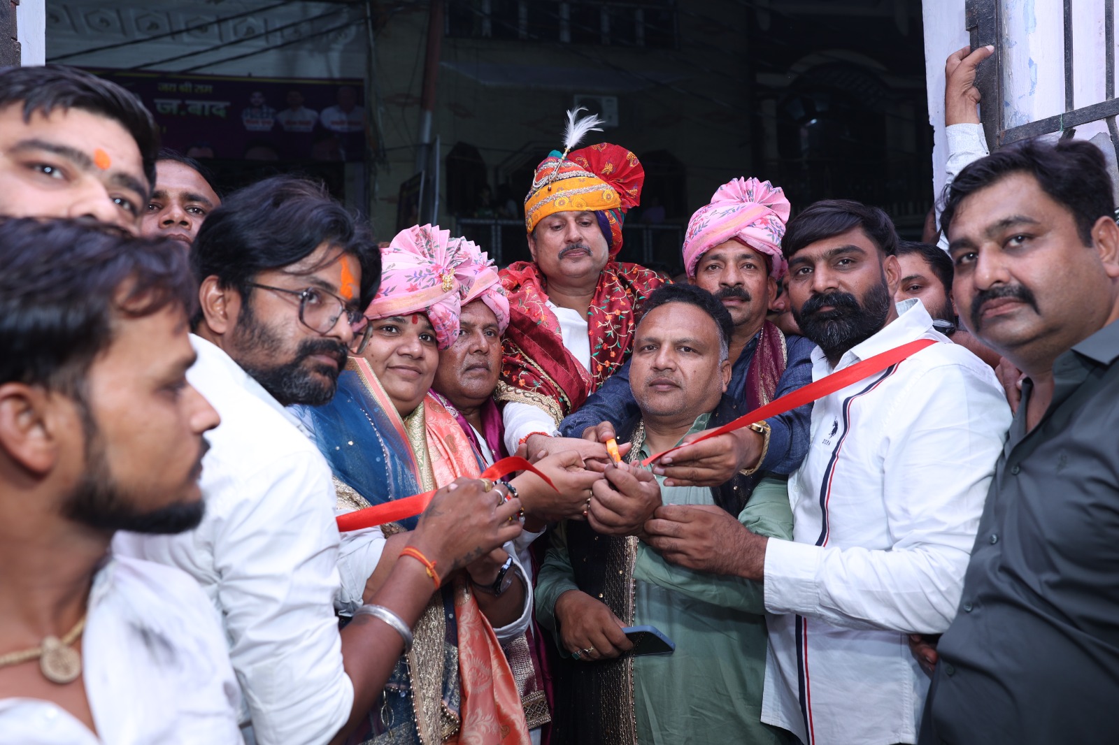 Guests cutting a ribbon to inaugurate the fair at the venue entrance