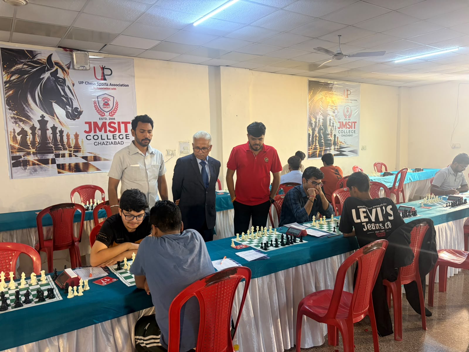 Participants play during the chess tournament in the JMSIT College hall.
