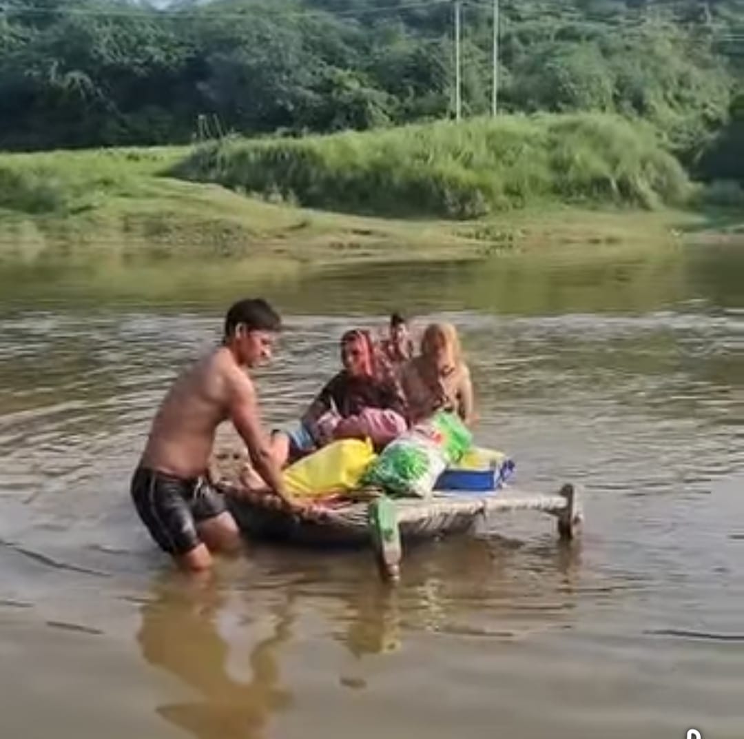 Woman and newborn carried across river on cot in Agra